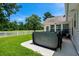 Outdoor patio area featuring a relaxing hot tub, perfect for enjoying the serene backyard and manicured lawn at 483 Oakmont Dr., Myrtle Beach, SC 29579