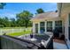 Backyard patio area featuring a relaxing hot tub, perfect for enjoying the serene backyard and manicured lawn at 483 Oakmont Dr., Myrtle Beach, SC 29579