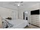Spacious bedroom features a ceiling fan, an ensuite bathroom, and a walk-in closet for ample storage at 483 Oakmont Dr., Myrtle Beach, SC 29579