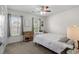 Cozy bedroom with carpet flooring, two windows, ceiling fan, and simple decor at 483 Oakmont Dr., Myrtle Beach, SC 29579