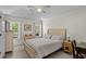 Serene bedroom with neutral tones, a ceiling fan, and large windows providing natural light and peaceful views at 483 Oakmont Dr., Myrtle Beach, SC 29579