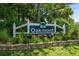 Community entrance sign for Oakmont, with lush greenery and a well-maintained landscape at 483 Oakmont Dr., Myrtle Beach, SC 29579