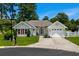 Charming single-Gathering home with a well-manicured lawn, red shutters, and attached two-car garage at 483 Oakmont Dr., Myrtle Beach, SC 29579