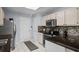 Well-lit kitchen with modern countertops, appliances, mosaic backsplash, and convenient access to the pantry at 483 Oakmont Dr., Myrtle Beach, SC 29579