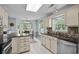 Bright kitchen featuring stainless steel appliances, granite countertops, and a dining area with scenic views at 483 Oakmont Dr., Myrtle Beach, SC 29579