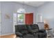 Open living area with hardwood floors, a recliner sofa, and view of the front door at 483 Oakmont Dr., Myrtle Beach, SC 29579