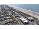 Gorgeous aerial view of a beachside community with a swimming pool, beach, and picturesque ocean scenery at 5000 N Ocean Blvd. # E-2, North Myrtle Beach, SC 29582