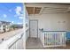 A covered balcony featuring a street view of nearby buildings at 5000 N Ocean Blvd. # E-2, North Myrtle Beach, SC 29582