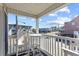 Balcony with white wood furniture overlooking street at 5000 N Ocean Blvd. # E-2, North Myrtle Beach, SC 29582