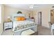 Bedroom with white furnishings, a TV, and an adjacent bathroom at 5000 N Ocean Blvd. # E-2, North Myrtle Beach, SC 29582