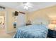 Comfortable bedroom with a full-sized bed, closet, and a mounted TV at 5000 N Ocean Blvd. # E-2, North Myrtle Beach, SC 29582