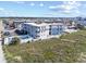 Aerial view of a condo building, showing its proximity to the beach and community pool at 5000 N Ocean Blvd. # E-2, North Myrtle Beach, SC 29582