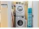 Compact laundry area with stacked washer and dryer, perfect for space-saving convenience at 5000 N Ocean Blvd. # E-2, North Myrtle Beach, SC 29582