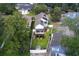 Aerial view of a charming two-story home surrounded by a white fence and lush greenery, showcasing its prime location at 505 41St Ave. S, North Myrtle Beach, SC 29582