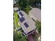 Aerial view of a home featuring solar panels on the roof and a well-manicured yard, highlighting energy efficiency at 505 41St Ave. S, North Myrtle Beach, SC 29582