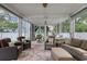 Relaxing back porch with comfortable wicker furniture, outdoor kitchen, and stylish decor at 505 41St Ave. S, North Myrtle Beach, SC 29582