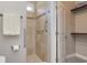 Modern tiled walk-in shower features safety bars and ample space, enhancing accessibility and convenience at 505 41St Ave. S, North Myrtle Beach, SC 29582