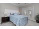 Cozy bedroom with a comfortable bed, soft lighting, and access to an outdoor balcony at 505 41St Ave. S, North Myrtle Beach, SC 29582