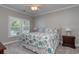 Comfortable bedroom with soft lighting and a nautical theme offers a serene retreat with a view of the outdoors at 505 41St Ave. S, North Myrtle Beach, SC 29582