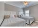 Bright bedroom with two beds, soft carpeting, and natural light from a window at 505 41St Ave. S, North Myrtle Beach, SC 29582