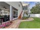 Charming home exterior with brick path, stairs to upper deck, and landscaped yard at 505 41St Ave. S, North Myrtle Beach, SC 29582