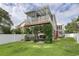 Two-story home featuring backyard entertaining spaces, outdoor kitchen, and lush backyard at 505 41St Ave. S, North Myrtle Beach, SC 29582