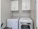 Functional laundry room featuring a modern washer and dryer, and ample storage cabinets at 505 41St Ave. S, North Myrtle Beach, SC 29582