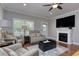 Cozy living room boasts a fireplace and ample seating, perfect for relaxation and entertaining guests at 505 41St Ave. S, North Myrtle Beach, SC 29582