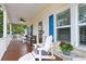 Relax on this inviting porch with comfortable seating and a ceiling fan, perfect for enjoying the outdoors at 505 41St Ave. S, North Myrtle Beach, SC 29582