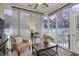 Inviting sunroom featuring neutral decor, comfortable seating, and large windows at 505 41St Ave. S, North Myrtle Beach, SC 29582