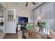 The sunroom has comfortable seating with a large television for indoor/outdoor enjoyment at 505 41St Ave. S, North Myrtle Beach, SC 29582