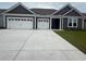 Charming home with a large driveway leading to a three-car garage at 528 Oak Landing Dr., Myrtle Beach, SC 29588