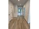 Bright hallway featuring elegant molding and luxury vinyl flooring throughout at 528 Oak Landing Dr., Myrtle Beach, SC 29588