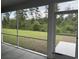 View from a screened-in porch, offering outdoor living and connection to the backyard at 528 Oak Landing Dr., Myrtle Beach, SC 29588