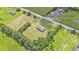 Aerial view of the home, surrounded by landscaping and greenery at 580 Circle M Rd., Longs, SC 29568