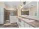 Bright bathroom with double sinks, a large mirror and a tiled walk-in shower at 580 Circle M Rd., Longs, SC 29568