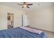 Bedroom with carpet, ceiling fan, and an attached bathroom at 580 Circle M Rd., Longs, SC 29568