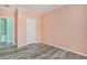 A spacious bedroom featuring hard surface floors and a white interior door at 580 Circle M Rd., Longs, SC 29568