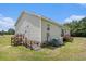 Home exterior with siding, wood ramps and green lawn at 580 Circle M Rd., Longs, SC 29568