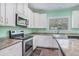 Kitchen featuring stainless steel appliances, granite countertops, and white cabinetry at 580 Circle M Rd., Longs, SC 29568