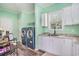 Laundry room with washer and dryer, sink and green painted walls at 580 Circle M Rd., Longs, SC 29568
