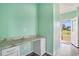 Office featuring a built in desk and drawers with access to the backyard at 580 Circle M Rd., Longs, SC 29568