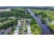 Stunning aerial view of the neighborhood with river access and lush green surroundings, pinpointing the property location at 5867 Rosewood Dr., Myrtle Beach, SC 29588