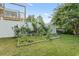 Serene backyard with a white fence, garden beds, and a charming space for outdoor enjoyment at 5867 Rosewood Dr., Myrtle Beach, SC 29588