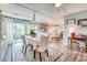 Open dining area features sliding glass doors leading to the backyard, seamlessly connecting indoor/outdoor spaces at 5867 Rosewood Dr., Myrtle Beach, SC 29588