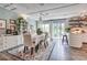 Bright dining room featuring a dining table, chairs, built-in shelving, and access to the backyard at 5867 Rosewood Dr., Myrtle Beach, SC 29588