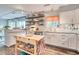 Well-equipped kitchen features white cabinetry, granite countertops, and modern appliances at 5867 Rosewood Dr., Myrtle Beach, SC 29588