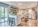Modern kitchen features a breakfast bar, white subway tile backsplash, and stainless steel appliances at 5867 Rosewood Dr., Myrtle Beach, SC 29588