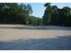 Spacious parking area surrounded by trees, providing ample parking for visitors and guests at 5867 Rosewood Dr., Myrtle Beach, SC 29588