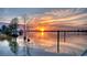 Scenic view of the sunset over the lake, highlighting the tranquil waterfront and serene environment at 5867 Rosewood Dr., Myrtle Beach, SC 29588